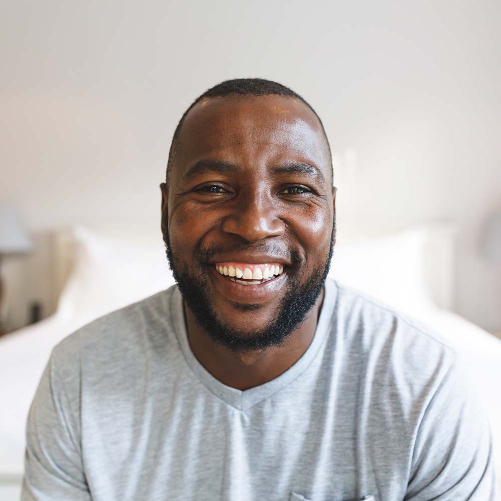 Home 5 portrait of happy african american man looking at KY33EHT 1 First Class Taxi